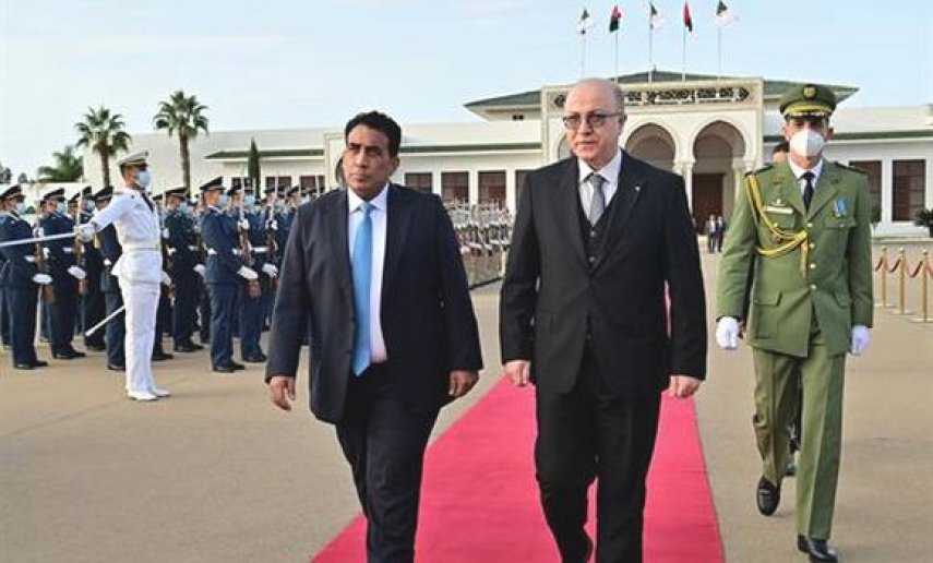 رئيس المجلس الرئاسي الليبي محمد المنفي والوزير الأول أيمن عبد الرحمان(يمين)